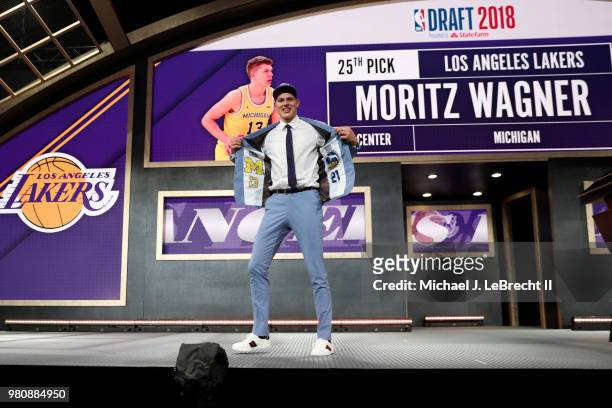 Moritz Wagner poses on the stage after been selected twenty-fifth by the Los Angeles Lakers on June 21, 2018 at Barclays Center during the 2018 NBA...