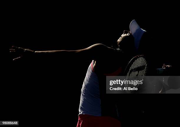 Marion Bartoli of France serves against Gisela Dulko of Argentina during day five of the 2010 Sony Ericsson Open at Crandon Park Tennis Center on...