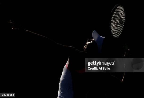 Marion Bartoli of France serves against Gisela Dulko of Argentina during day five of the 2010 Sony Ericsson Open at Crandon Park Tennis Center on...