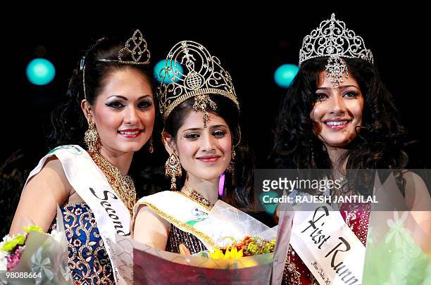 Year old South African Kajal Lutchminarain is crowned queen flanking by second Princess Cher Merchand from Suriname and first Princess Niharica...