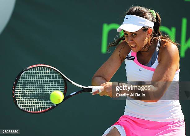 Marion Bartoli of France returns a shot against Gisela Dulko of Argentina during day five of the 2010 Sony Ericsson Open at Crandon Park Tennis...