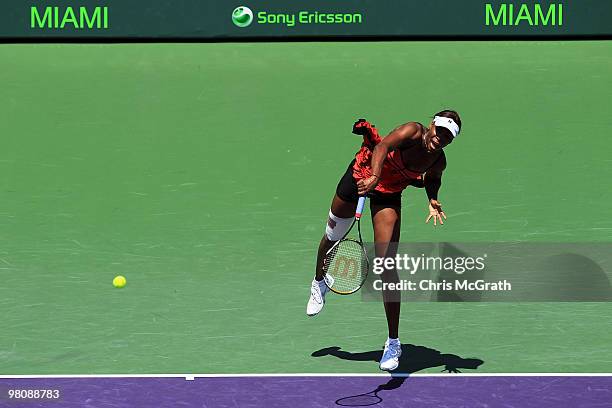 Venus Williams of the United States serves against Roberta Vinci of Italy during day five of the 2010 Sony Ericsson Open at Crandon Park Tennis...