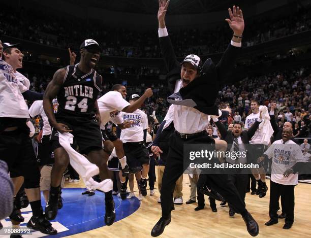 Head coach Brad Stevens of the Butler Bulldogs celebrates with teammates after defeating the Kansas State Wildcats during the west regional final of...