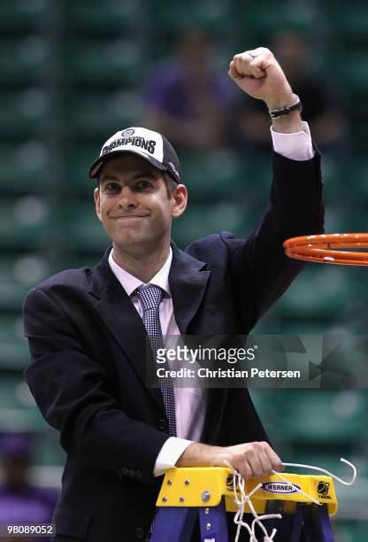 Head coach Brad Stevens of the Butler Bulldogs celebrates after cutting down the net and defeating the Kansas State Wildcats in the west regional...