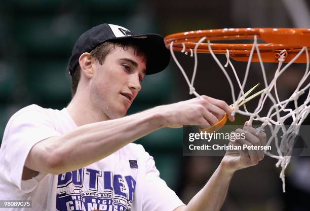 Gordon Hayward of the Butler Bulldogs cuts down the net after defeating the Kansas State Wildcats in the west regional final of the 2010 NCAA men's...