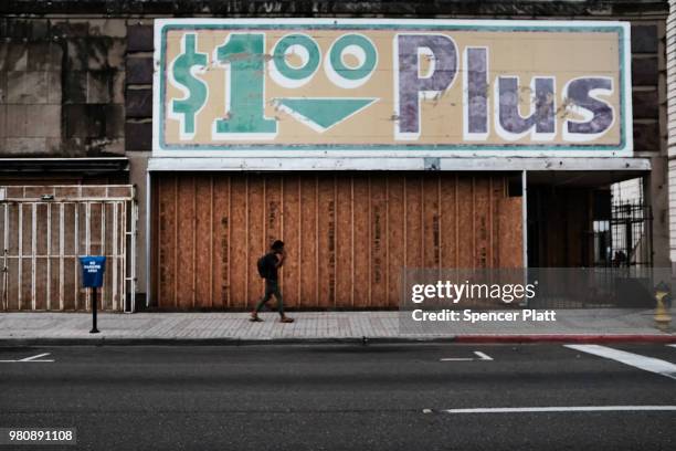 Shuttered store stands in downtown Brownsville, a border city which has become dependent on the daily crossing into and out of Mexico on June 21,...