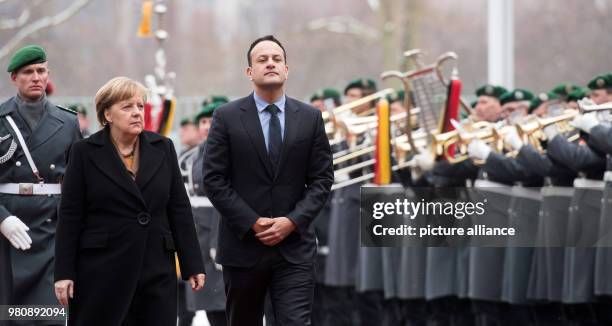 March 2018, Germany, Berlin: German Chancellor Angela Merkel receives Irish Prime Minister Leo Varadkar with military honours at the German...