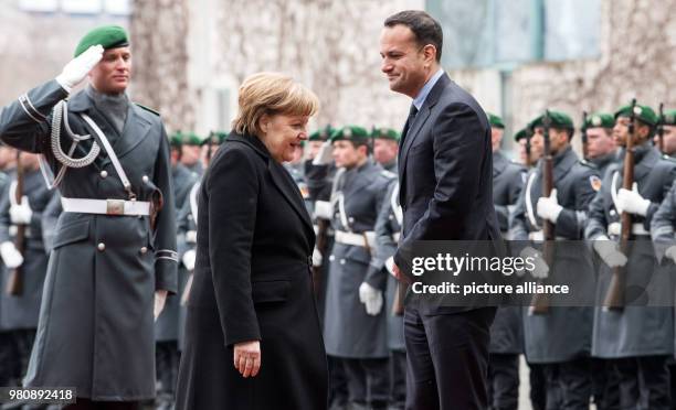 March 2018, Germany, Berlin: German Chancellor Angela Merkel receives Irish Prime Minister Leo Varadkar with military honours at the German...