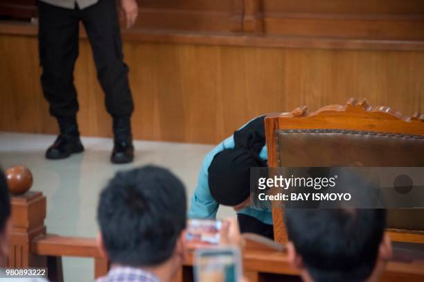 Aman Abdurrahman , who masterminded a 2016 gun and suicide attack in the capital Jakarta that left four attackers and four civilians dead, kisses the...