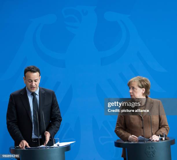 March 2018, Germany, Berlin: German Chancellor Angela Merkel and Irish Prime Minister Leo Varadkar speaking at a press conference after their meeting...