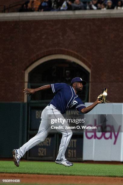 Jose Pirela of the San Diego Padres commits a fielding error on a ball hit by Pablo Sandoval of the San Francisco Giants during the eighth inning at...