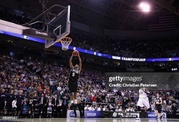 Ronald Nored of the Butler Bulldogs drives to the basket against the Kansas State Wildcats in the final moments of the west regional final of the...