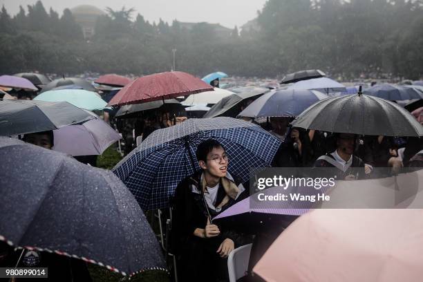 The graduates carry umbrellas during their ceremony of Wuhan University on June 22, 2018 in Wuhan, China.China is forecast to produce 8.2 million...