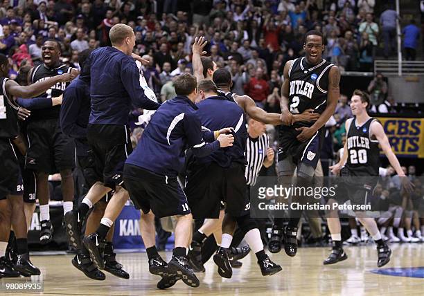 Shawn Vanzant of the Butler Bulldogs celebrates with teammates after defeating the Kansas State Wildcats in the west regional final of the 2010 NCAA...