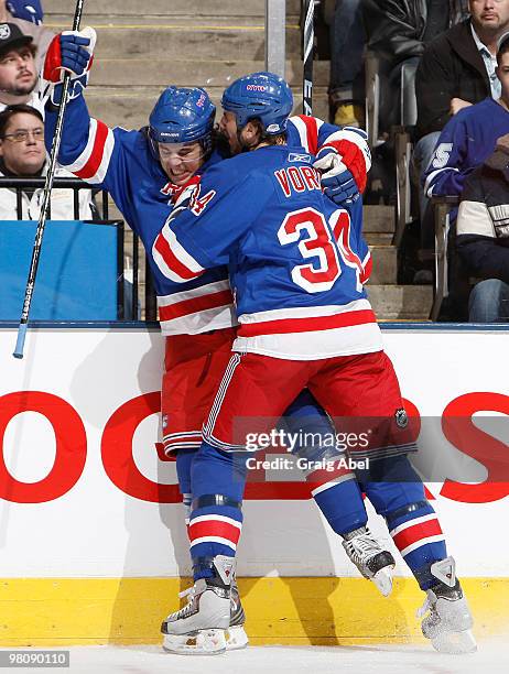 Parenteau and Aaron Voros of the New York Rangers celebrate a first period goal against the Toronto Maple Leafs during game action March 27, 2010 at...