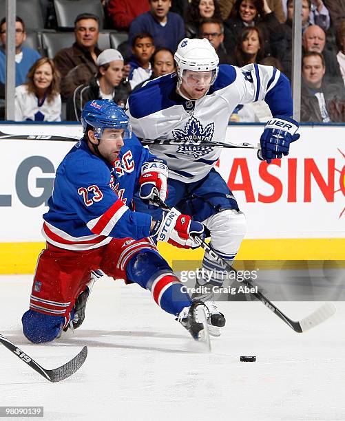 Phil Kessel of the Toronto Maple Leafs battles for the puck with Chris Drury of the New York Rangers during game action March 27, 2010 at the Air...