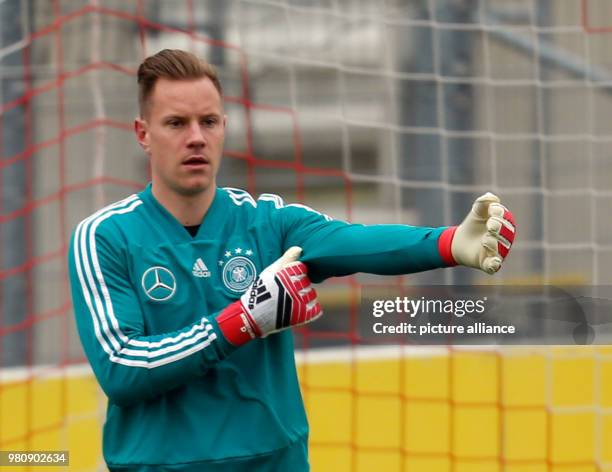 March 2018, Germany, Duesseldorf: Germany team training session: Goalies Marc-Andre ter Stegen warming up. Germany are due to play Spain in a...