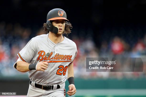 Colby Rasmus of the Baltimore Orioles rounds the bases after hitting a solo home run against the Washington Nationals in the second inning at...