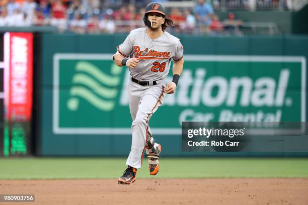 Colby Rasmus of the Baltimore Orioles rounds the bases after hitting a solo home run against the Washington Nationals in the second inning at...