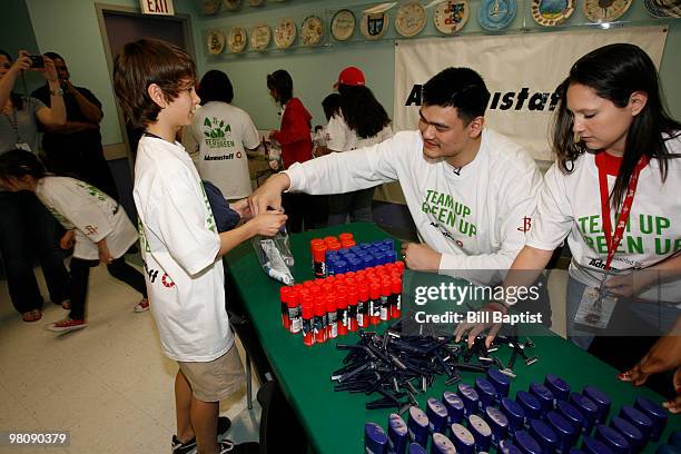Yao Ming of the Houston Rockets helps fill hygiene bags for the homeless on March 26, 2010 at the SEARCH Homeless Shelter in Houston, Texas. NOTE TO...