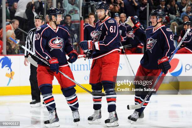 Kristian Huselius, Rick Nash and Anton Stralman, all of the Columbus Blue Jackets, celebrate after R.J. Umberger of the Columbus Blue Jackets scored...