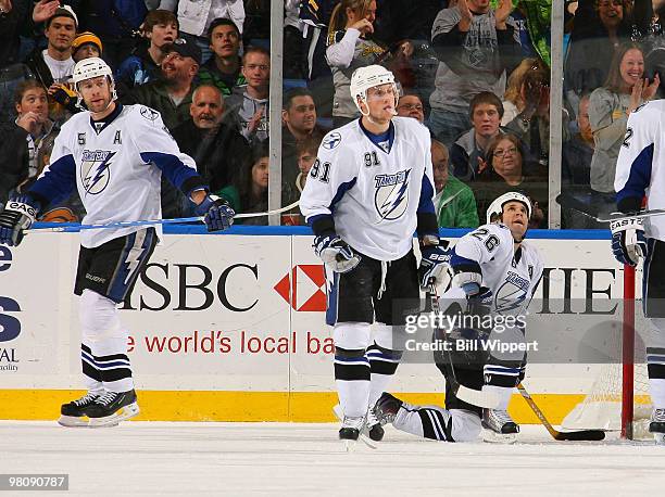 Mattis Ohlund, Steven Stamkos, and Martin St. Louis of the Tampa Bay Lightning look dejected after the Buffalo Sabres fifth goal on March 27, 2010 at...