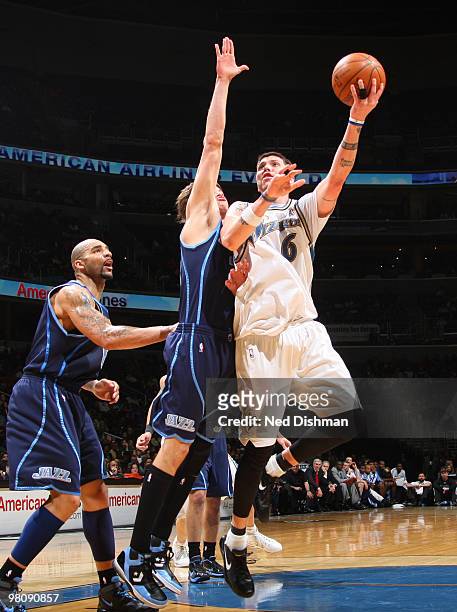 Mike Miller of the Washington Wizards shoots against Kyle Korver of the Utah Jazz at the Verizon Center on March 27, 2010 in Washington, DC. NOTE TO...
