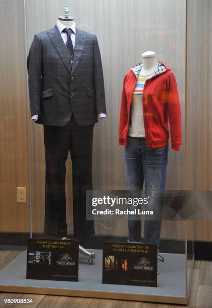 Original costumes worn by actors Toby Jones and Isabella Sermon in "Jurassic: World: Fallen Kingdom" are displayed inside Universal Cinema at...