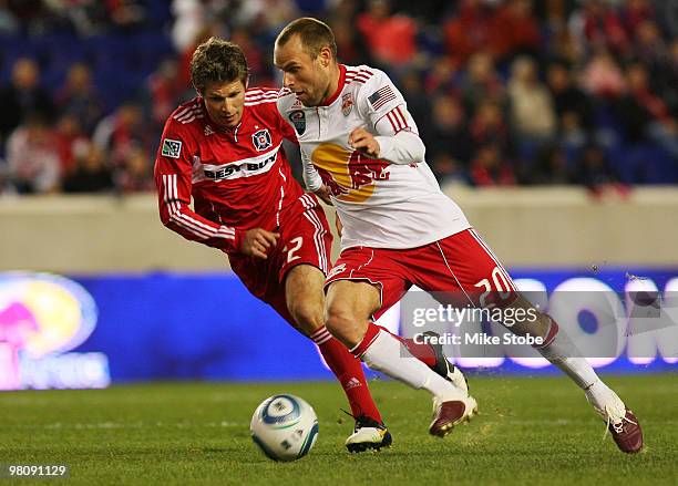 Logan Pause of the Chicago Fire pursues Joel Lindpere of the New York Red Bulls on March 27, 2010 at Red Bull Arena in Harrison, New Jersey. Red...