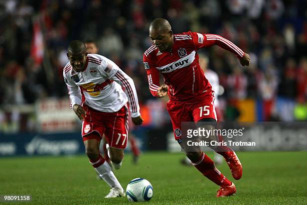 John Collins of the Chicago Fire out paces Jeremy Hall of the New York Red Bulls during the match at Red Bull Arena on March 27, 2010 in Harrison,...
