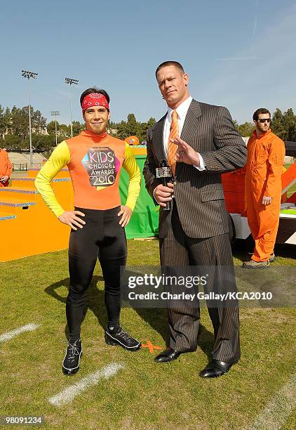 Speed skater Apolo Ohno and actor/wrestler John Cena onstage during a pre-filmed segment for Nickelodeon's 23rd Annual Kids' Choice Awards held at...