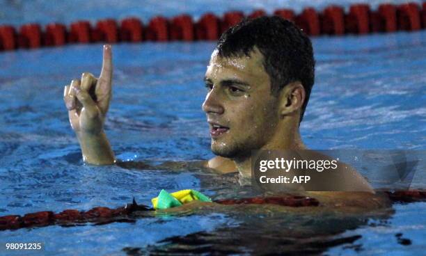 Brazilian Leonardo Deus reacts after winning gold medal in the men's 200m butterfly competition during the IX South American Games in Medellin,...