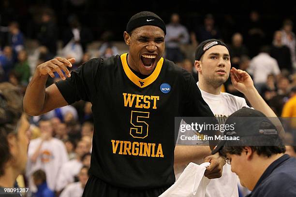 Kevin Jones of the West Virginia Mountaineers celebrates after West Virginia won 73-66 against the Kentucky Wildcats during the east regional final...