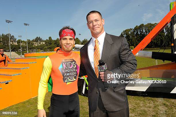 Speed skater Apolo Ohno and actor/wrestler John Cena onstage during a pre-filmed segment for Nickelodeon's 23rd Annual Kids' Choice Awards held at...