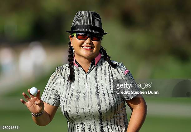 Christina Kim holds up her ball after making a putt on the 14th hole during the third round of the Kia Classic Presented by J Golf at La Costa Resort...