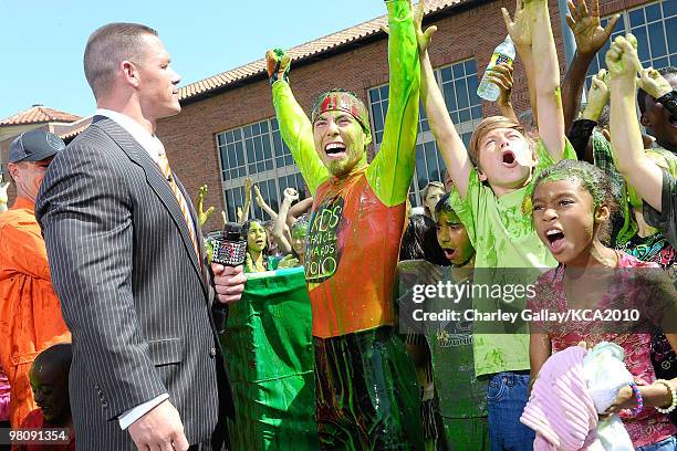 Speed skater Apolo Ohno and actor/wrestler John Cena onstage during a pre-filmed segment for Nickelodeon's 23rd Annual Kids' Choice Awards held at...