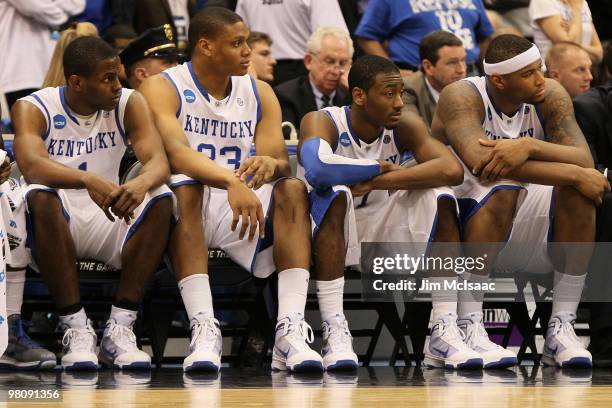 Darius Miller, Daniel Orton, John Wall and DeMarcus Cousins of the Kentucky Wildcats sit dejected on the bench during the final minutes of the second...