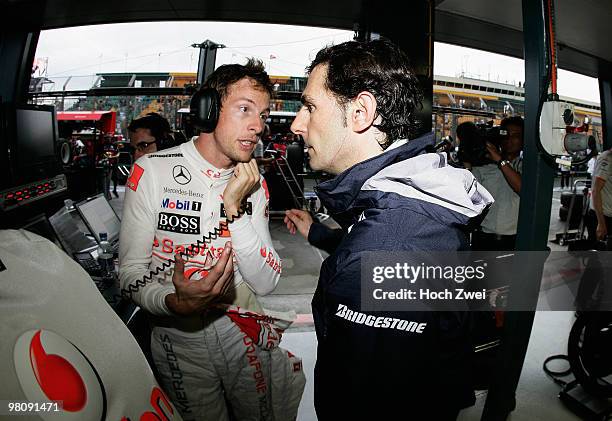 Jenson Button of Great Britain and McLaren Mercedes talks with Pedro de la Rosa of Spain and BMW Sauber during practice for the Australian Formula...