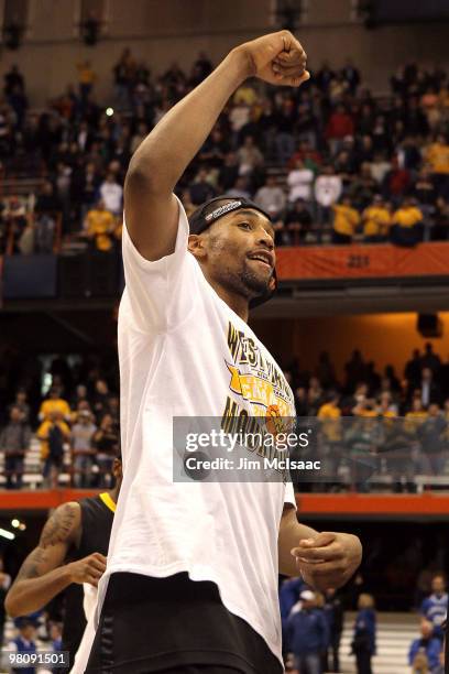 Da'Sean Butler of the West Virginia Mountaineers celebrates after West Virginia won 73-66 against the Kentucky Wildcats during the east regional...
