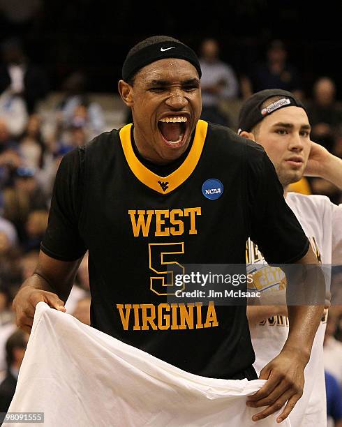 Kevin Jones of the West Virginia Mountaineers celebrates after West Virginia won 73-66 against the Kentucky Wildcats during the east regional final...