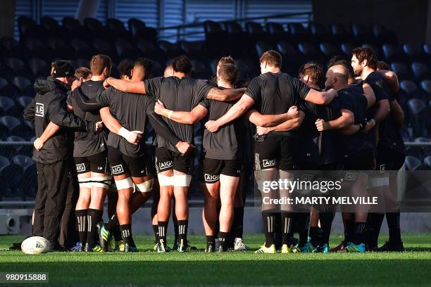 New Zealand's rugby players huddle during the captain's run at Forsyth Barr Stadium in Dunedin on June 22 a day ahead of the All Blacks' rugby union...