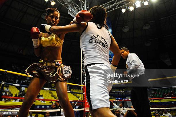 Ogledis Suarez of Venezuela fights with Vanesa Medrano of Colombia during their boxing match in La Guaira, Venezuela on March 27, 2010. Suarez beat...