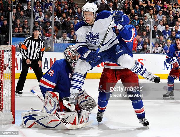 Nikolai Kulemin of the Toronto Maple Leafs jumps in front of goalie Henrik Lundqvist of the New York Rangers during game action March 27, 2010 at the...