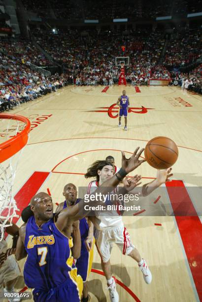 Lamar Odom of the Los Angeles Lakers shoots the ball over Luis Scola of the Houston Rockets on March 27, 2010 at the Toyota Center in Houston, Texas....