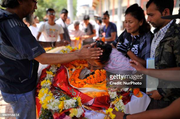 Mother of late Narayan Gopal Maharjan give last tribute on body in Kathmandu, Nepal on Thursday, June 21, 2018. The final rites of Nepali mountain...
