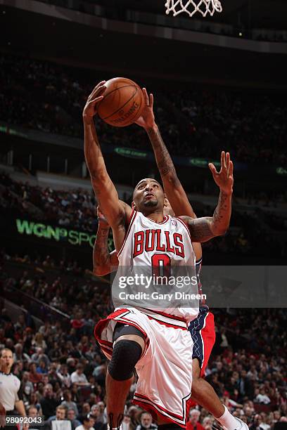 Acie Law of the Chicago Bulls shoots a layup against Chris Douglas-Roberts of the New Jersey Nets on March 27, 2010 at the United Center in Chicago,...