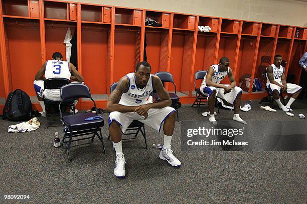 Darnell Dodson, Ramon Harris, Darius Miller and Eric Bledsoe of the Kentucky Wildcats sit in the locker room dejected after they lost 73-66 against...