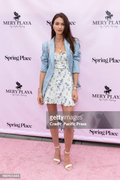 Katrina Kruglova wearing dress by Reformation attends Mery Playa by Sofia Resing swimsuit launch at Spring Place Rooftop.