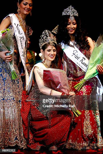 Miss South Africa Kajal Luthchminarain is crowned Winner of the Miss India Worldwide 2010 flanked by Miss Suriname Cher Marchand second Princess and...
