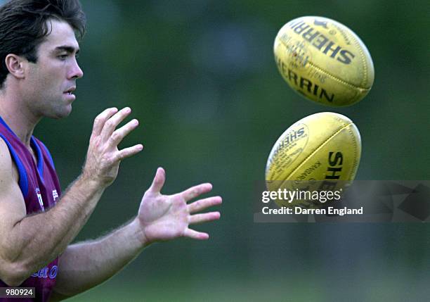 Brad Scott of the Brisbane Lions warms up at training in preperation for the Ansett Cup Grand Final match against Port Adelaide this weekend. The...